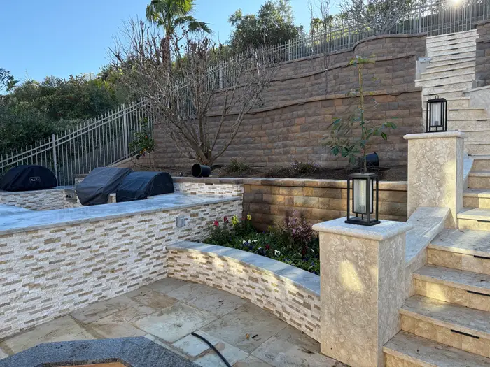 Outdoor kitchen beside stone stairs